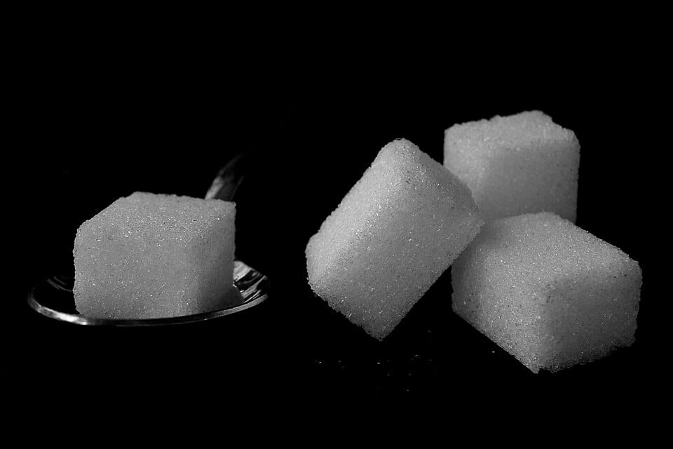 Sugar cubes illustrating added sugar to avoid